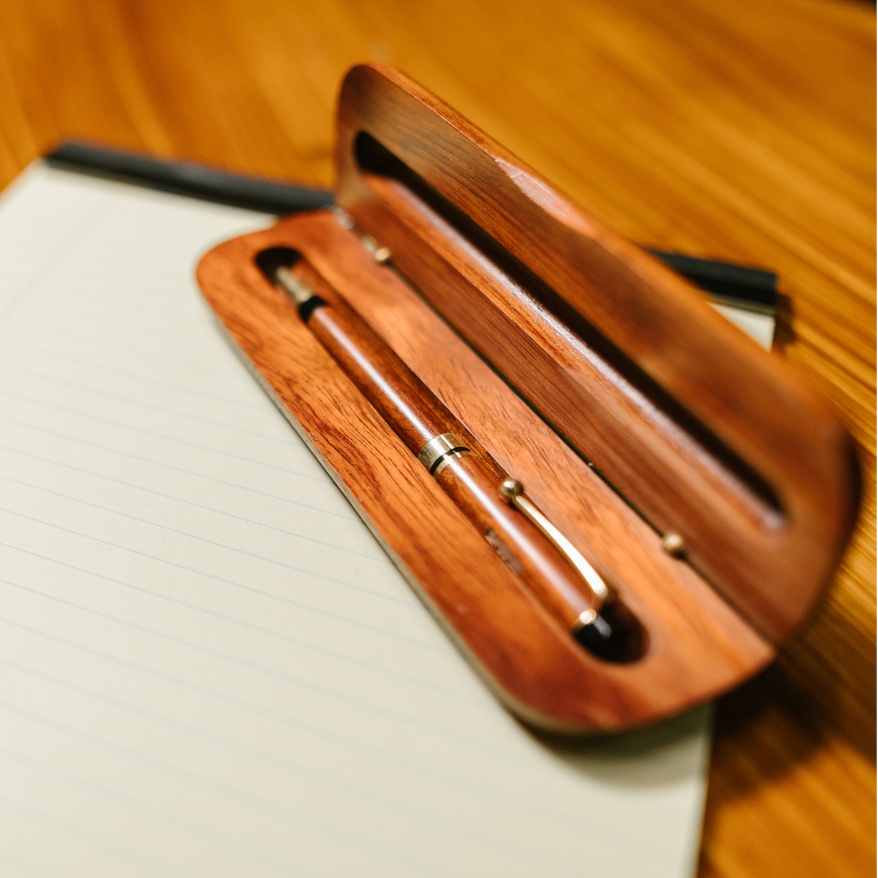 Pen and case on notebook