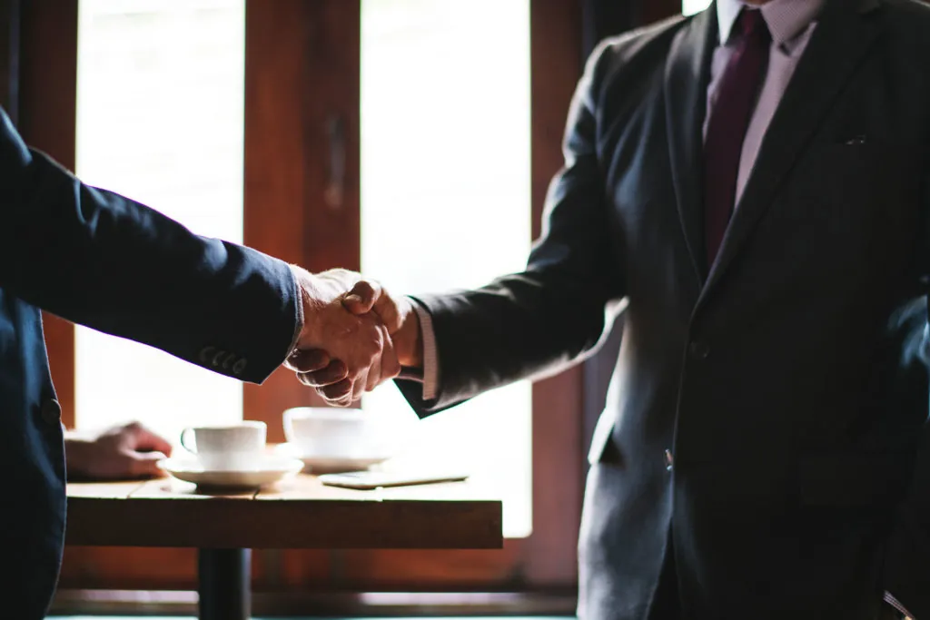 Two business people shaking hands