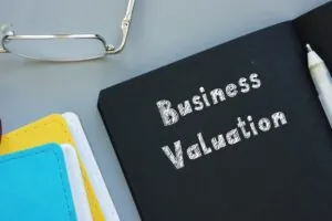 Business Valuation with inscription on the sheet.