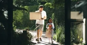 Box, moving in or walking with dad and daughter at new home at other state
