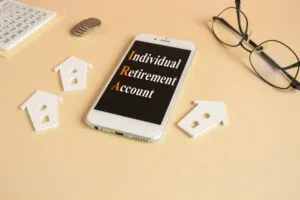 Words Individual retirement account on the mobile phone screen.
