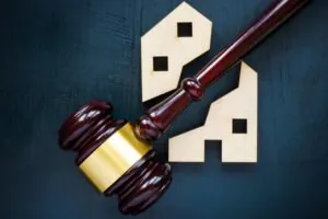 House of two parts and gavel. Concept of Property Division in divorce